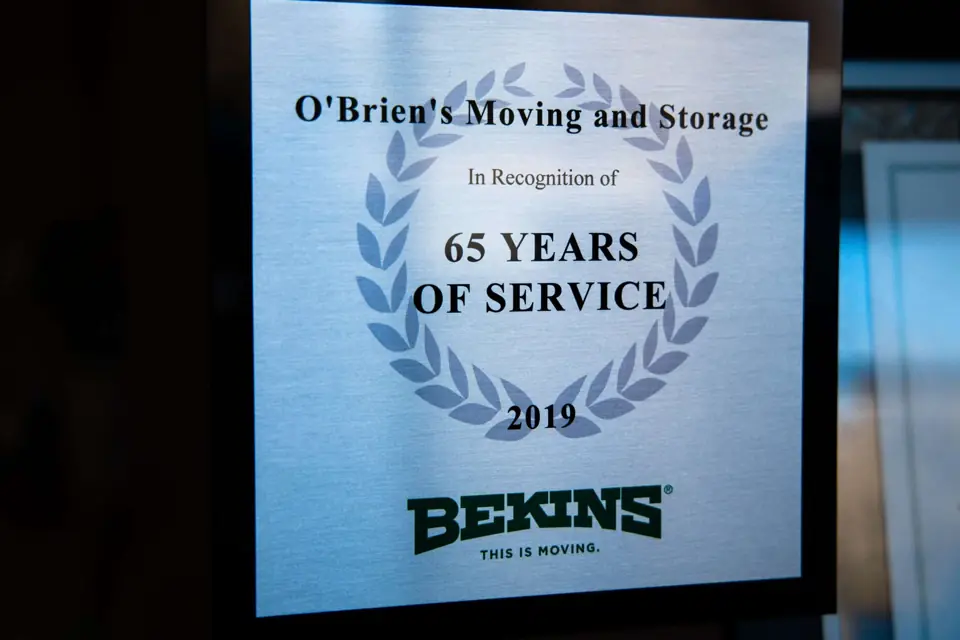 Bekins plaque recognising O'Brien's Moving and Storage for 65 years of service