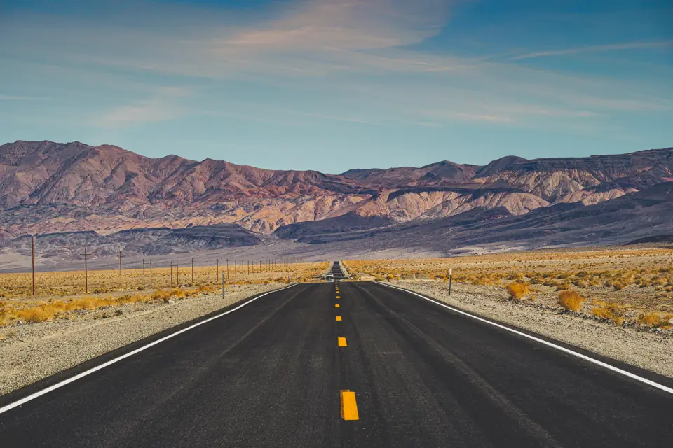 Car on an open desert highway