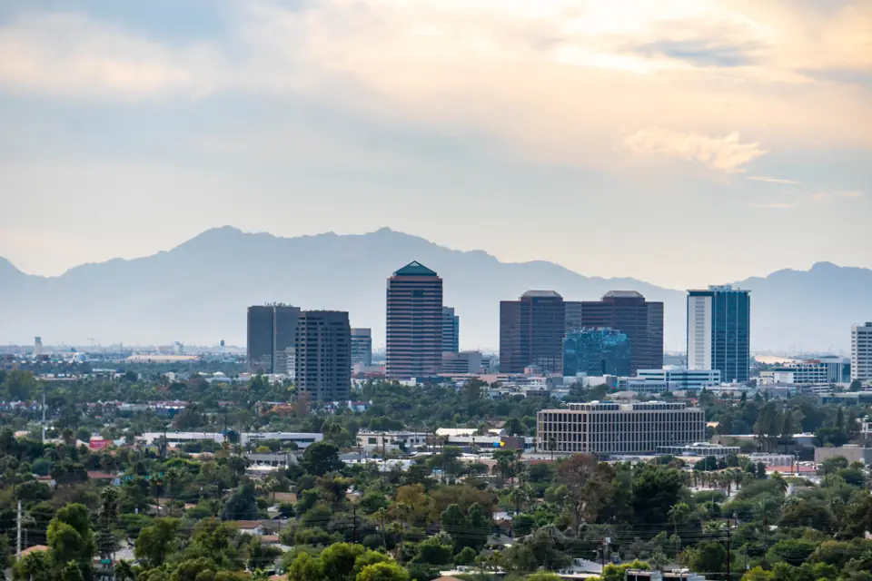 Downtown Phoenix, Arizona skyline with desert mountains behind