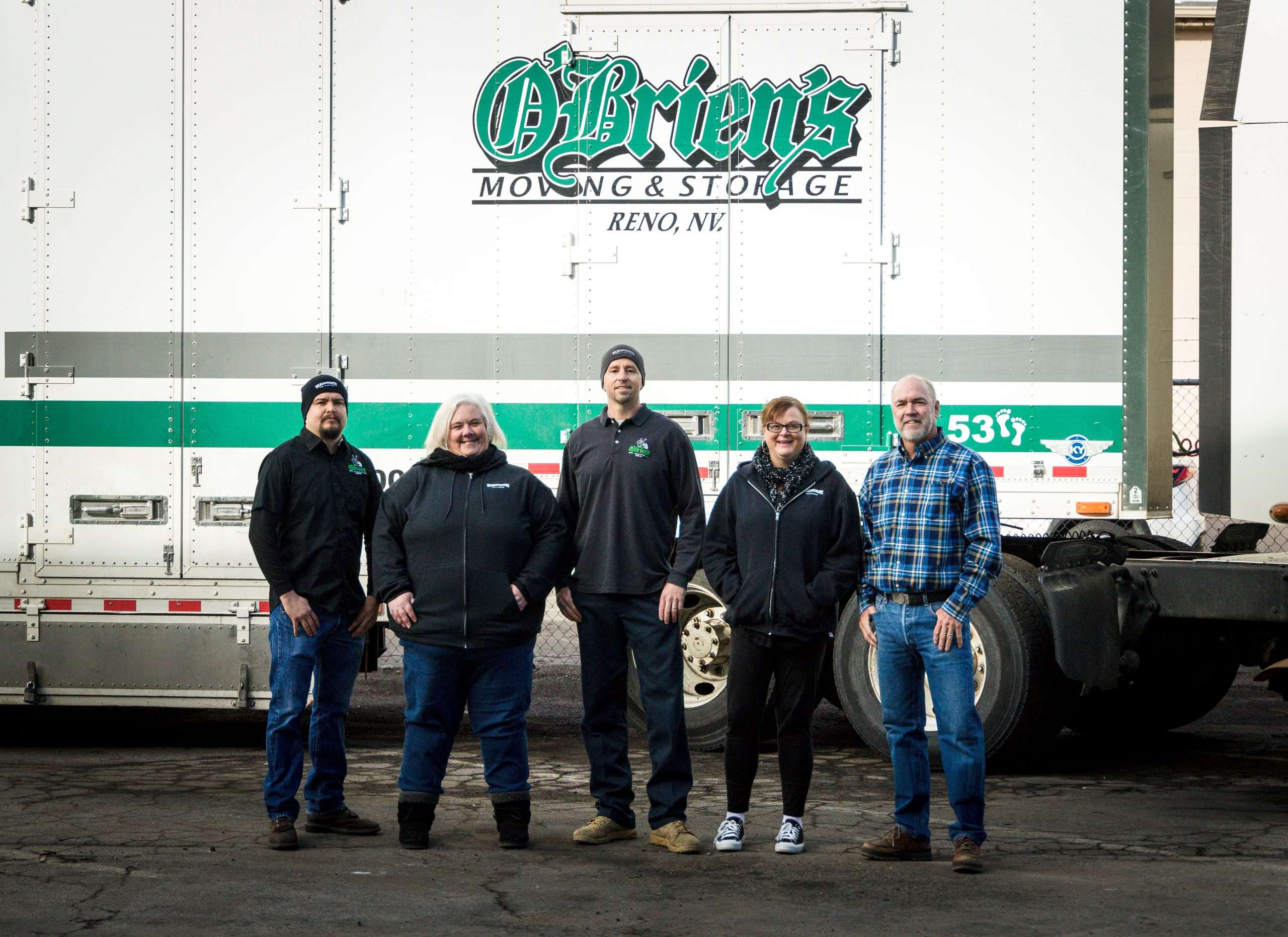 O'Briens Moving and Storage Owners Standing in front of Semi- trailer