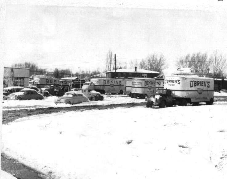 O'Briens Moving trucks in snow 1950's
